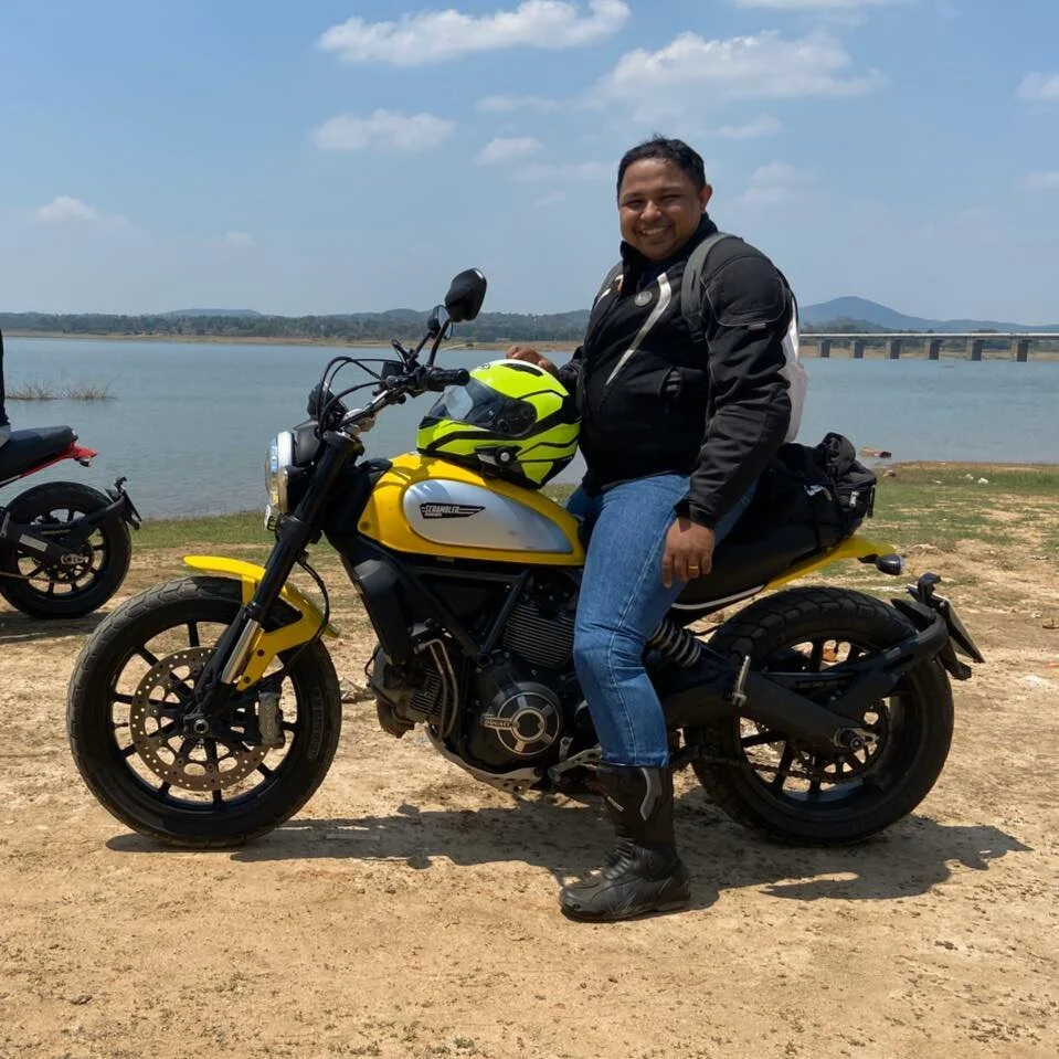 Snehanjan with his Ducati on a stretch of empty beach